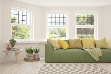 Naklejka premium Minimalist living room in white color with sofa and summer landscape in window. Scandinavian interior design. 3D illustration