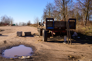 Photo of garbage dump in a slum outdoors on a caravan on a clear sunny day