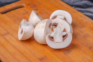 sliced mushrooms on a cutting Board