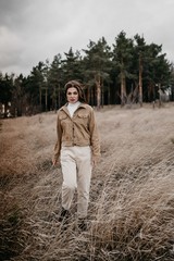 Love story of Oleg and Anastasia. Stylish photo shoot in the forest in cloudy weather.