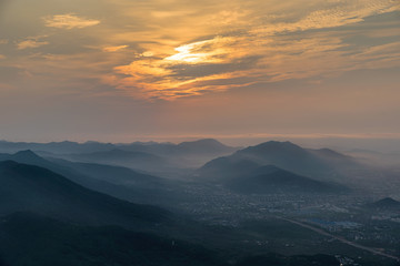 At sunrise, mist enveloped the distant city