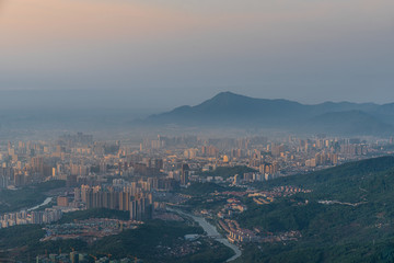 At sunrise, mist enveloped the distant city