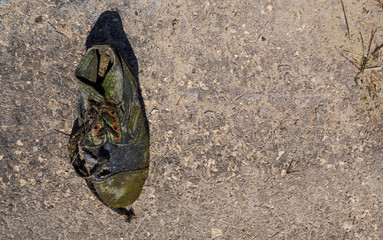 old dirty boot from a lake