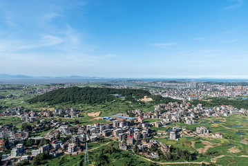 The mountain overlooks the rich town