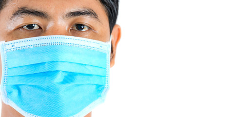Close-up portrait of man wearing protection face mask against coronavirus