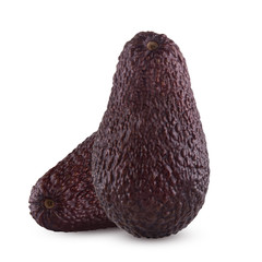 Brown avocado with avocado leaves on a white background.