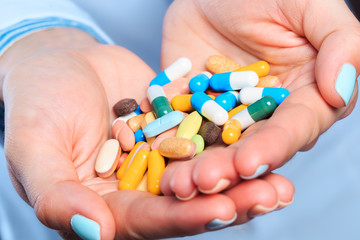 Doctor hand holding pills close up view  - Image