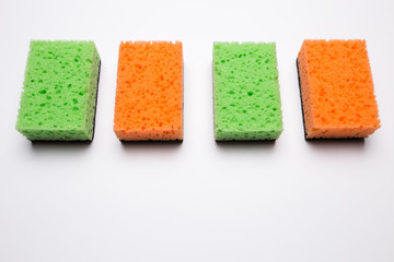 Sponge for washing dishes on a white isolated background.