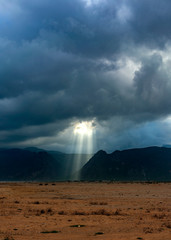 Sun rays through storm clouds in Socotra World Heritage Site in Yemen