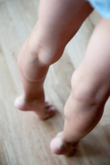 strong sport healthy body part of little kid showing his muscular calves and legs