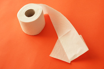 toilet paper on a pink background