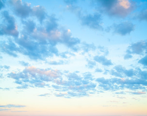 Blue sky clouds background. Beautiful landscape with clouds and orange sun on sky