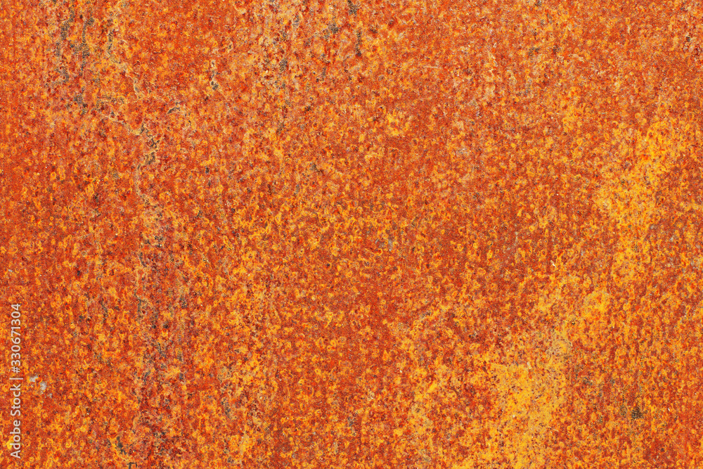 Wall mural closeup surface of an old abandoned rusty sheet of metal. abstract trendy modern rust texture backgr