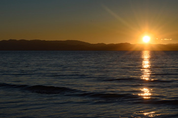 Fototapeta na wymiar Peaceful calm sunset. New Zealand seascape