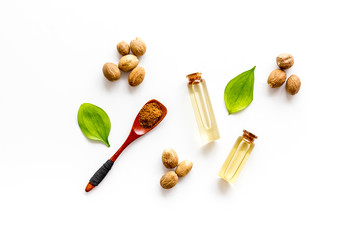Nutmeg oil - aromatherpy concept - on white background top-down