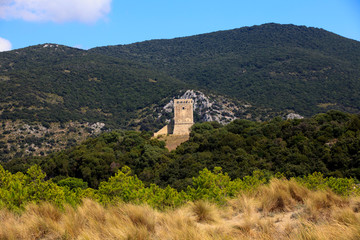 Fototapeta na wymiar Alberese (GR), Italy - June 10, 2017: Collelungo tower in Uccellina Natural Reserve, Alberese, Grosseto, Tuscany, Italy, Europe
