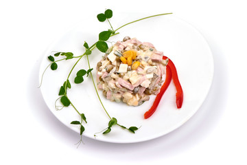 Russian traditional salad olivier, isolated on white background