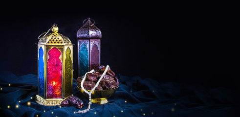 Ramadan Background  2020 special Islamic photos, new colorful Ramadan Mubarak isolated with black background and Turkish light lamp with dates and Tasbeeh