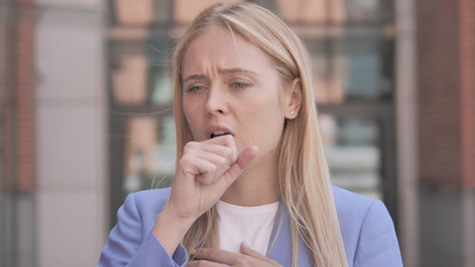 Sick Young Businesswoman Coughing Outdoor