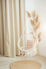 Stylish modern room interior with swing chair