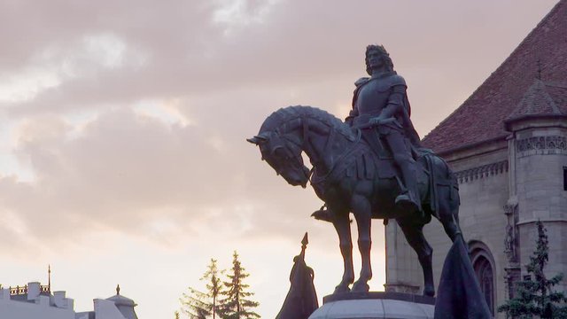 Slow motion shot of Mathias Rex statue in Cluj main square. Romania Transylvania