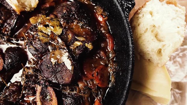Delicious ossobuco in a pan. Traditional Italian food.