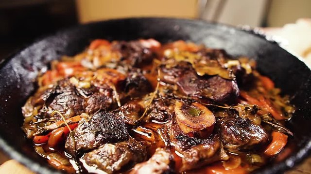 Delicious ossobuco in a pan. Traditional Italian food.