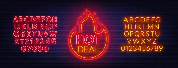 Hot deal neon sign. Neon alphabet on brick wall background. © TanyaFox
