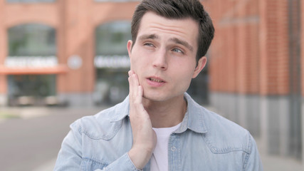Toothache, Outdoor Portrait of Young Man with Tooth Pain