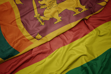 waving colorful flag of bolivia and national flag of sri lanka.