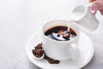 cream is poured coffee cup