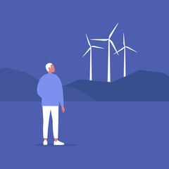 Fototapeta premium Renewable energy source, young male character looking at the wind turbines on the horizon, Eco friendly responsible behaviour, sustainability