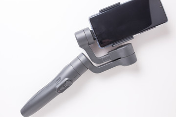 Mobile image stabilizer for smartphones on a white isolated background.