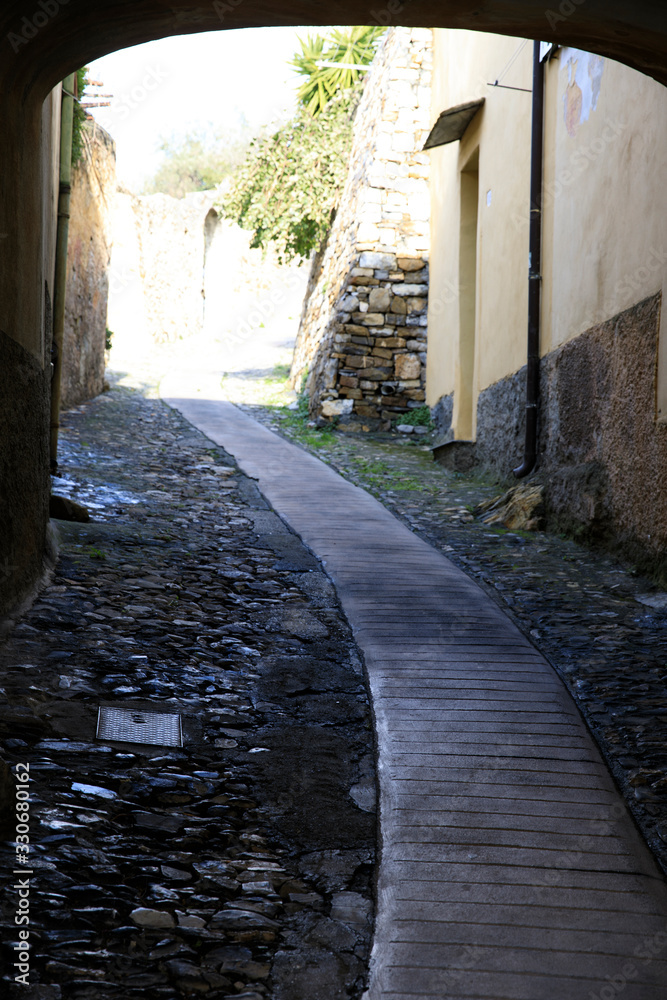 Wall mural Cervo (IM), Italy - December 30, 2017: A tipycal road in Cervo village, Italian Riviera, Imperia, Liguria, Italy