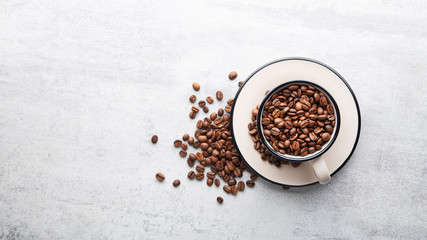 Cup filled with roasted coffee beans