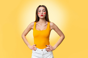 The concept of equal rights and feminism. An isolated shot of a Caucasian woman with red makeup....