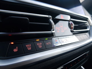 Obraz na płótnie Canvas Car elements. Temperature control device on car center console