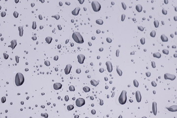 Natural rain droplets on glass.