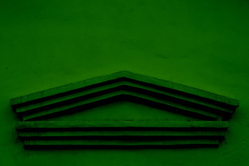 Dark green background for text with a geometric figure in antique style.