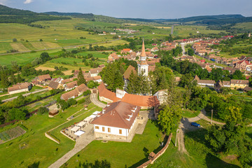 Fototapeta na wymiar The fortified Church and parish house in Crit, Brasov, Romania. Also known as Deutsch Kreuz village