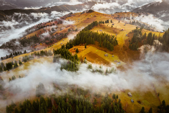 Romania landscape on a foggy autumn morning in Fundata, Brasov on the Rucar Bran pass