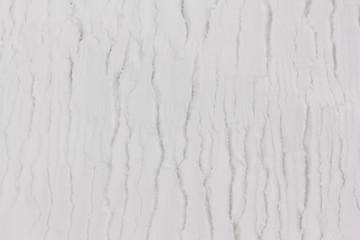 Cracks on the snowy surface of the river