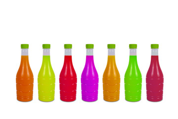 Colorful plastic fruit juice bottles isolated on white background