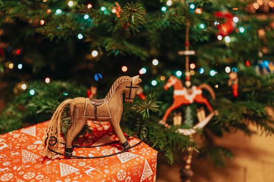Christmas time horse decorations made of wood and wrapped present