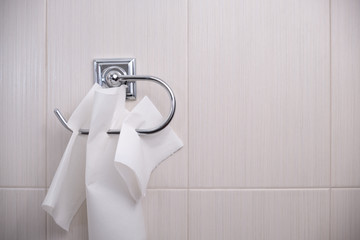 Using kitchen paper in toilet. Left shot