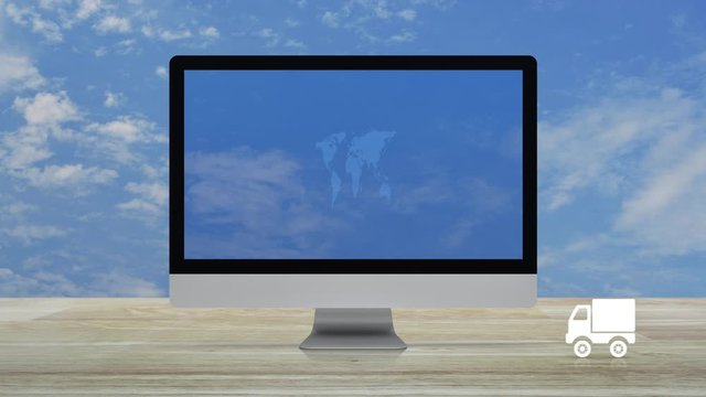Delivery truck icon with connection line and world map on modern computer monitor screen on wooden table over blue sky with white clouds, Business transportation online concept, Elements of this image