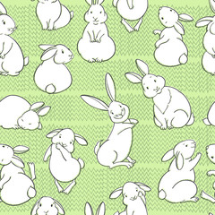 Cute rabbits on the grass.Seamless pattern. Cartoon vector illustration. Animal background.