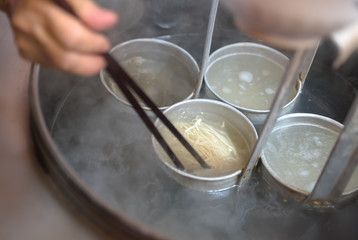 The cooking process of Chinese traditional snacks, noodles served with soy sauce and pansit