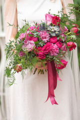 wedding purple boho bouquet in bride's hands