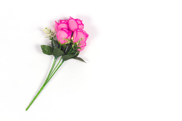Naklejka na ściany i meble Artificial rose isolated on white background.Valentine's day flowers.Plastic rose 